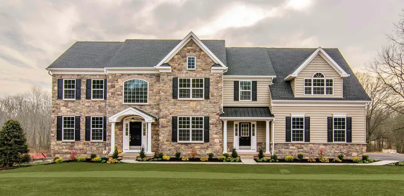 Large Luxury Home with Stone and Tan Siding