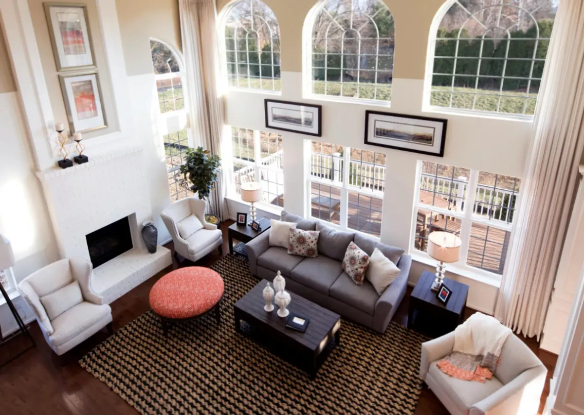 Large Living Room With High Ceilings and Large Windows