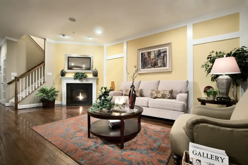 Living Room with a Fireplace and two couches in a Hallmark home