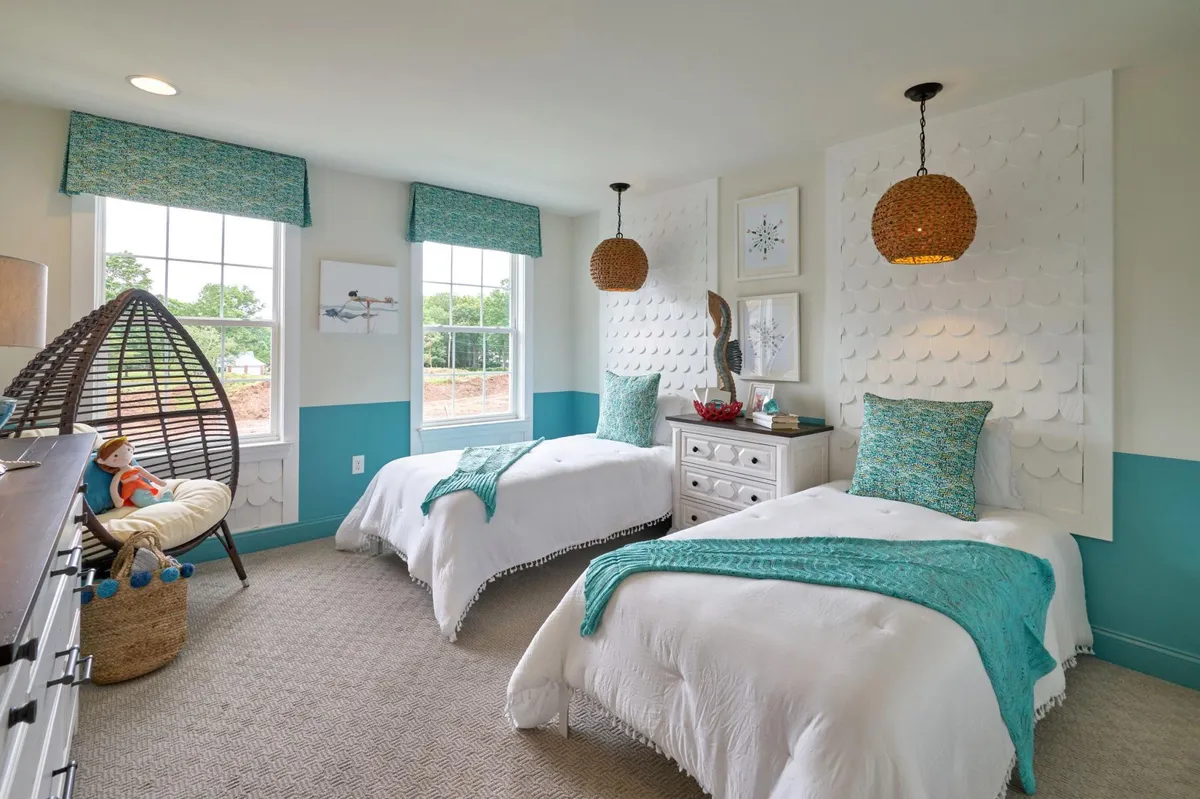 Bedroom with green accents from Hallmark Homes Group