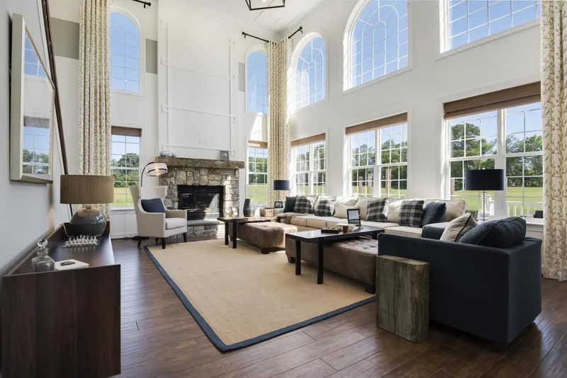 Large Living room with High Ceilings and Fireplace in a Hallmark Home