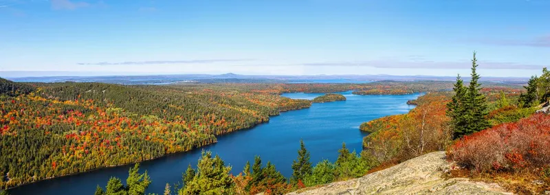 Large Lake surrounded by Fall Foliage