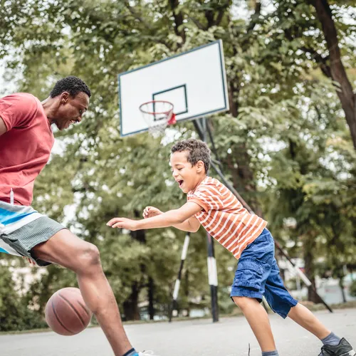 Father and Son Playing Basketball