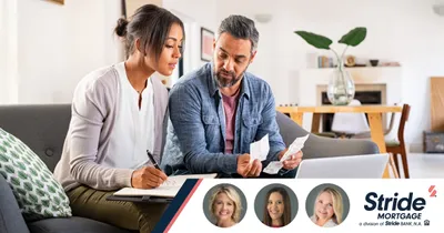 A man and a woman looking over paperwork. Bottom right: Stride Mortgage logo.