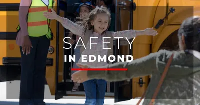 Child with safety officers in Edmond OK