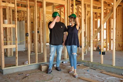 Homeowners inside home under construction