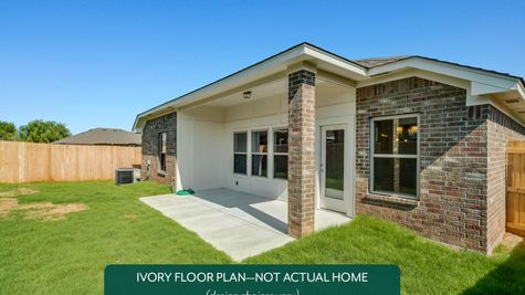 Ivory. Example photo of covered patio in new home in Norman, OK