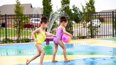 Jacobson. Children playing in the splash pad