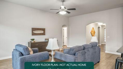 Ivory. Example photo of living room in new home in Norman, OK