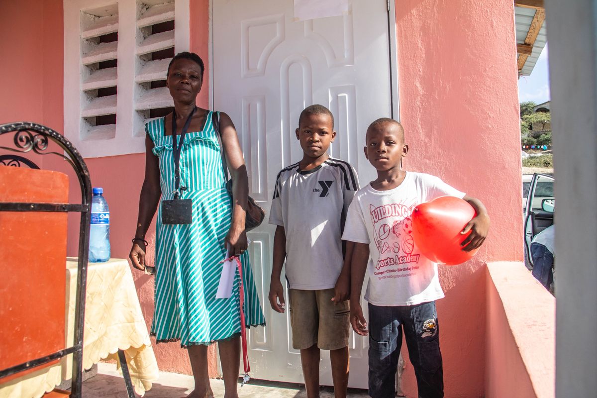 Family in Haiti living in a new home built by Homes for Hope