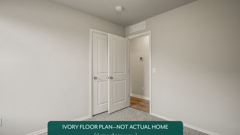Ivory. Example photo of secondary bedroom in new home in Norman, OK