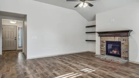 Fitzgerald. Living Room with Fireplace & Open Shelving