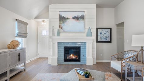 Gabriella. Main Living Area with Shiplap Fireplace and Aqua Tiled Surround