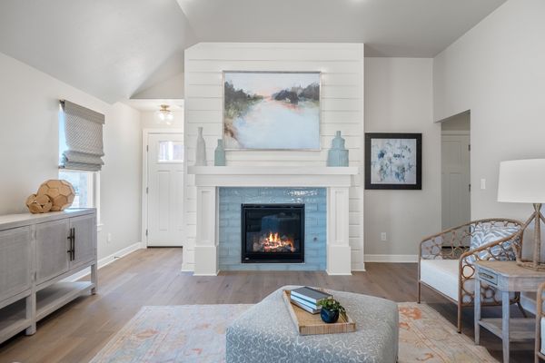 Gabriella. Main Living Area with Shiplap Fireplace and Aqua Tiled Surround