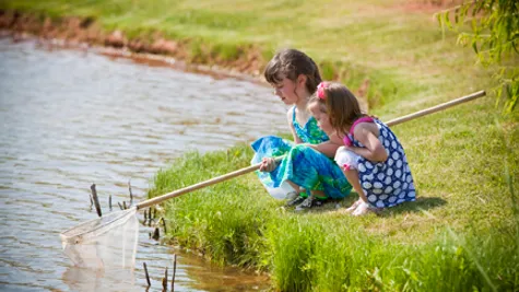 Gabriella. Children fishing in the pond