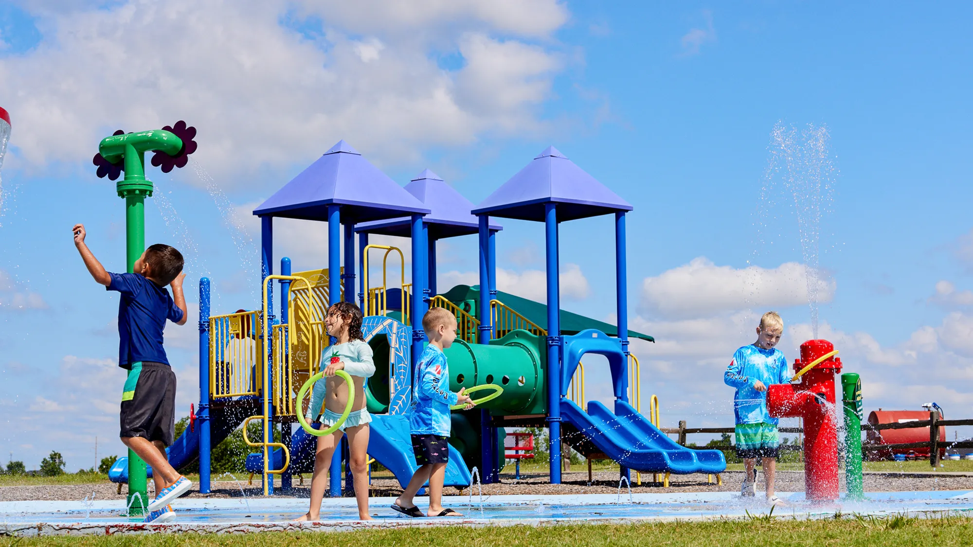  Children at the splashpad and playground in Featherstone - new homes in Moore, OK