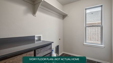 Ivory. Example photo of laundry room in new home in Norman, OK