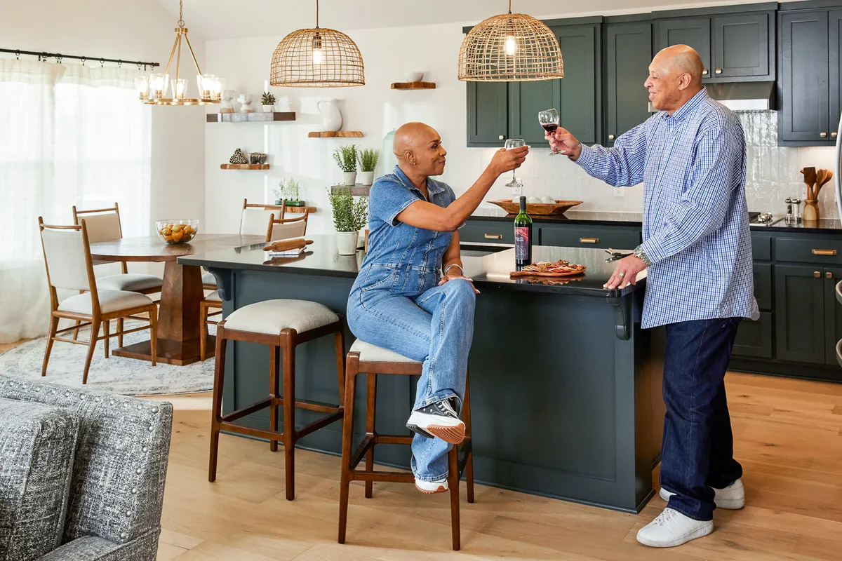 couple enjoying glass of wine in new Ideal home