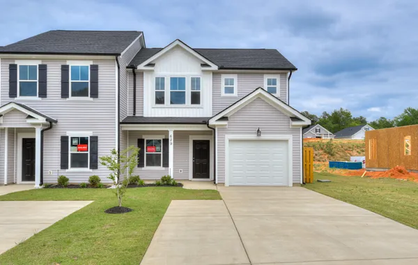 Front exterior view of the new 3-bedroom Athens townhome model for sale by Ivey Homes, located at 629 Hampton Drive in the Windsor community of North Augusta, South Carolina.