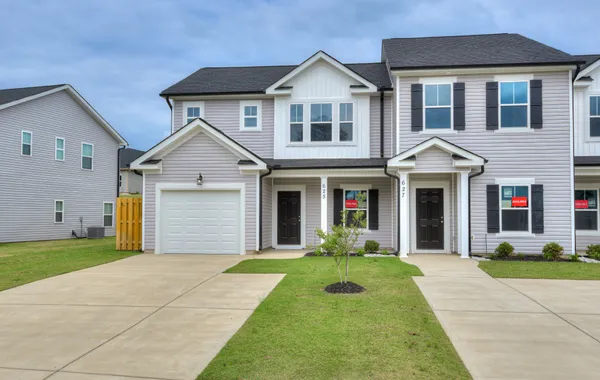 Front view of a new 3-bedroom Athens townhome with garage and covered patio located at 625 Hampton Drive in Windsor, North Augusta SC, featuring a charming exterior and first-floor powder room.