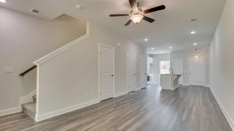 Spacious and contemporary main living area in a new construction townhome at 878 Rachel Branch Forrest Bluff, North Augusta, SC, featuring an open floor plan, large windows, and modern finishes.