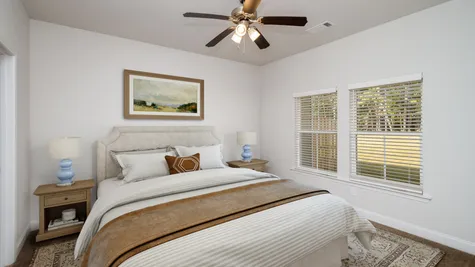 A large and inviting bedroom with ample natural light in one of the new townhomes at 1012 Candleberry Drive, Grovetown, GA, crafted by Ivey Homes.