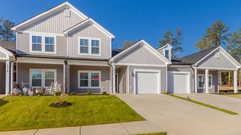 Exterior shot of brand new townhomes at 1012 Candleberry Drive in Caroleton Townhomes, a community built by Ivey Homes, showcasing modern design and architecture, located in Grovetown, Georgia.