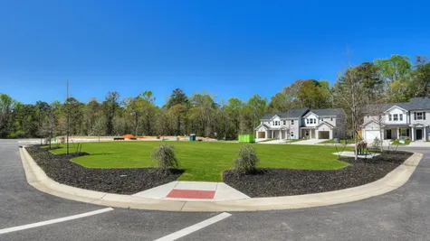 Brand new single-family homes and townhomes in Forrest Bluff, North Augusta, SC 29841, with a lush open park area nestled in the heart of the neighborhood.