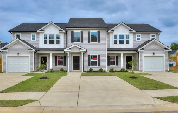 Front view of a brand-new Athens plan 2-bedroom townhome with garage and covered patio located at 627 Hampton Drive in Windsor, North Augusta, SC.