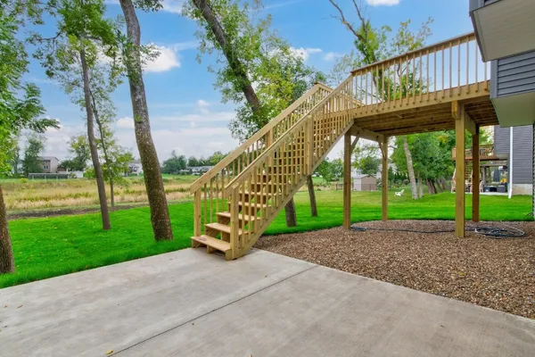 Enjoy nature from the deck or patio lot backs up to green space