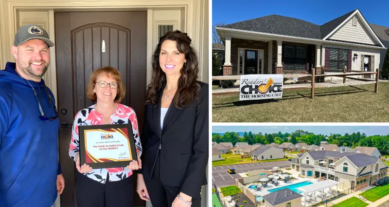 Sandy on right (Sales Manager), Karen in middle (Sales Assistant) and Justin on left (Site Superintendent), for Indian Creek. Reader's Choice award banner in Indian Creek, and luxurious community clubhouse.