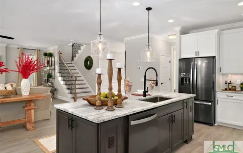 Kitchen with Leathered Granite Tops and Black Stainless Appliances different angle