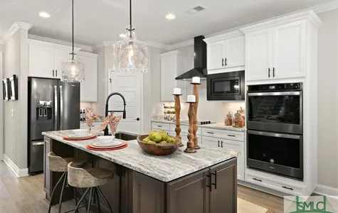 Kitchen with Leathered Granite Tops and Black Stainless Appliances another angle