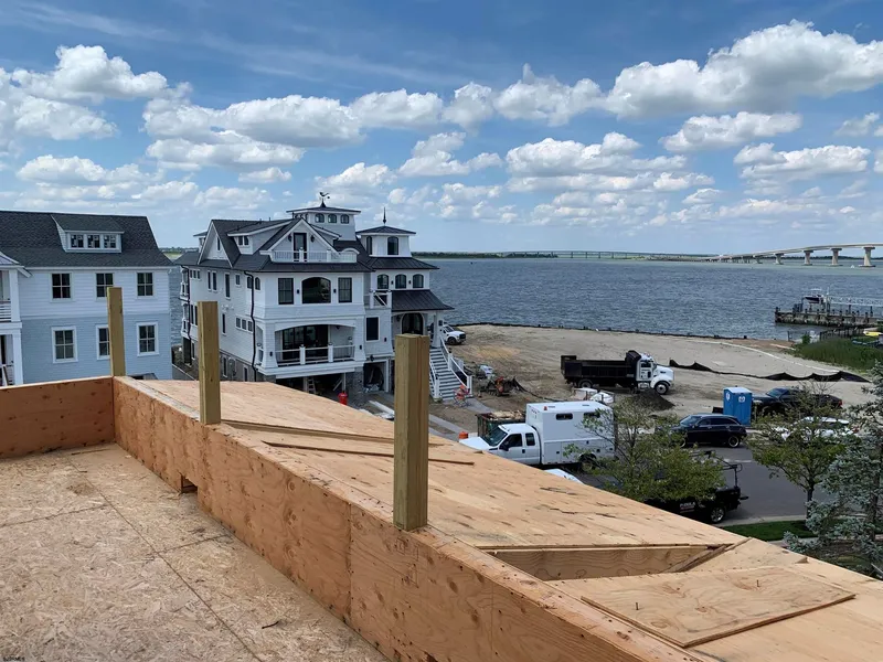 home under construction with views of bay and beach