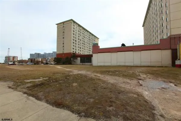 Empty lot with mid rise buildings adjacent