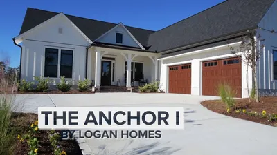 exterior home with a four car garage in leland nc by logan homes