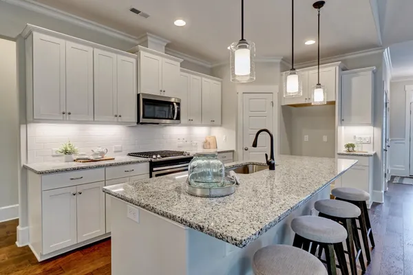 kitchen in a new home in porters neck nc by logan homes