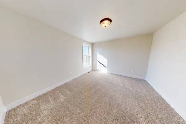 empty bedroom in the annafeld subdivision by mccall homes
