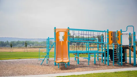 playground in a new home community by mccall homes