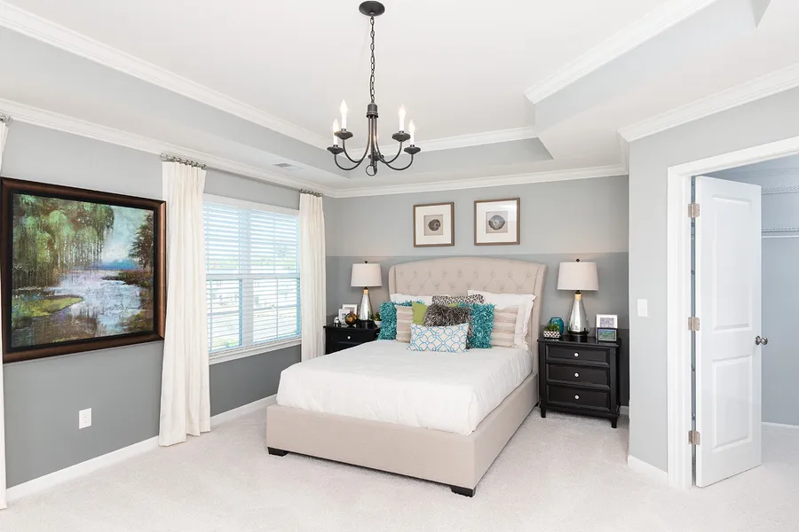 Primary bedroom in new construction home by Mungo Homes in hewing farms