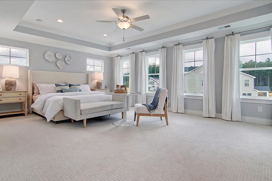 Coastal decor primary bedroom in new construction home by Mungo Homes