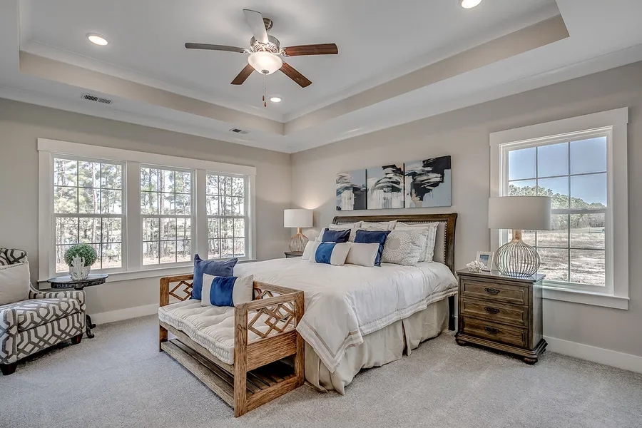 bedroom in a new home in the portrait hill community by mungo homes