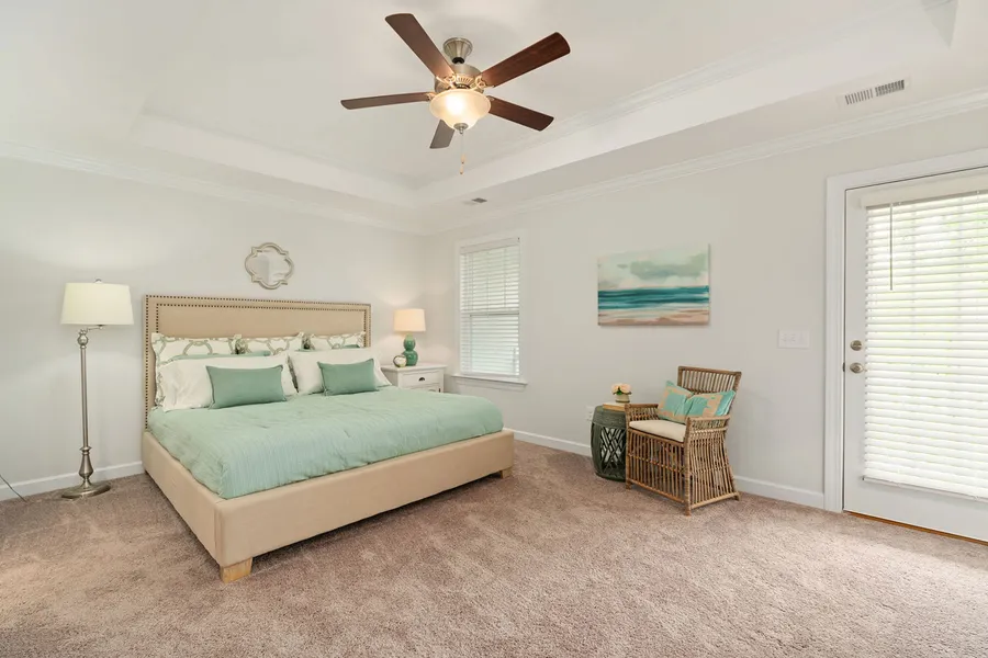 bedroom in a new home at the falls community by mungo homes