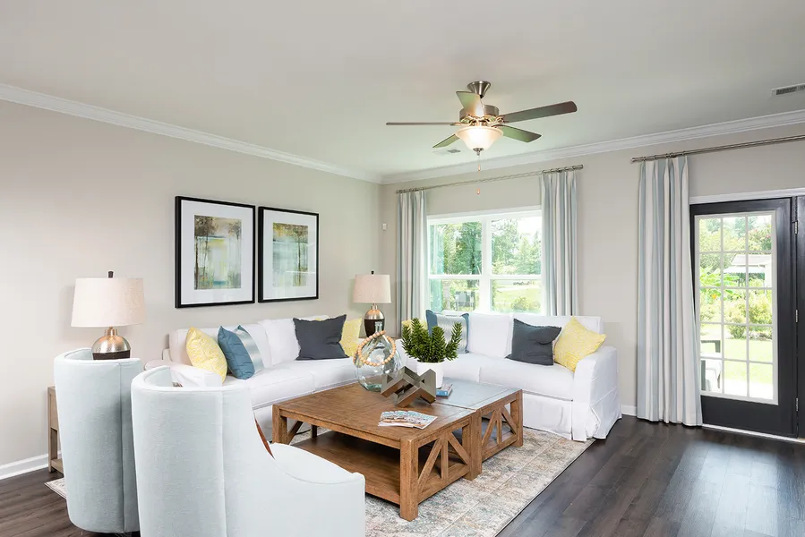 living room in a new home community, east main meadows, by mungo homes