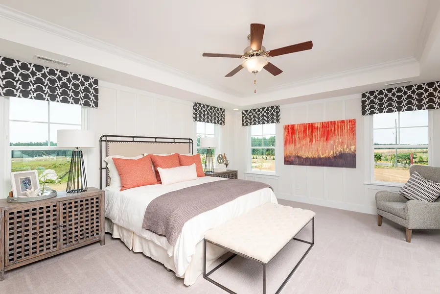 Primary bedroom in new construction home in mackey farms by mungo homes