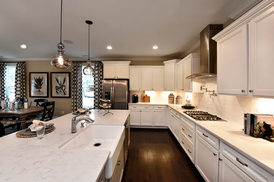 White kitchen with black accents in new construction home by Mungo Homes