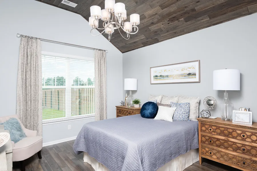 Primary bedroom in new construction home at jessamine place by mungo homes