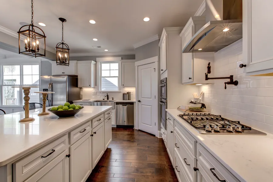 Open kitchen with white cabinets in new construction home in johns island sc