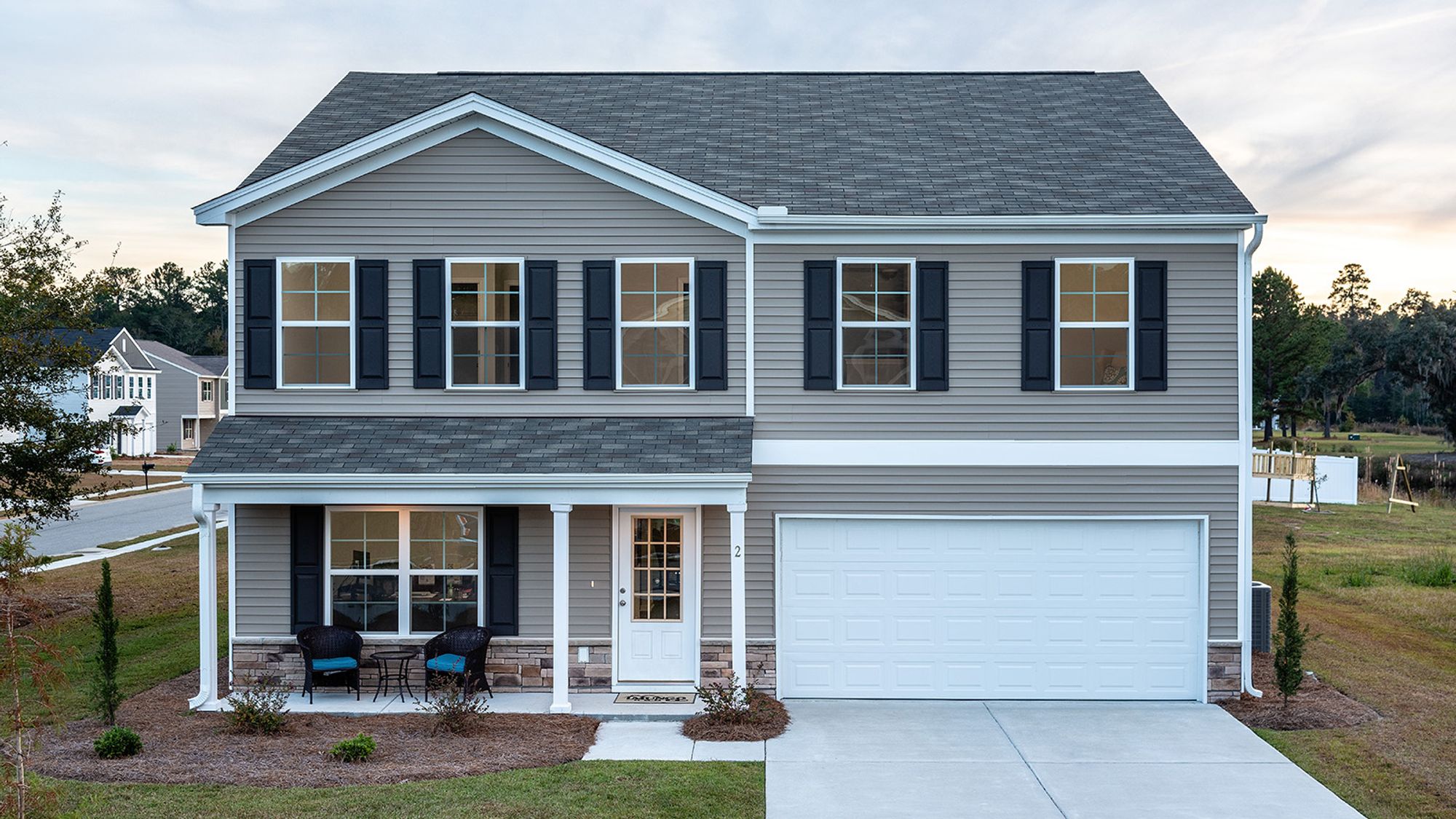 Two-story new home with front porch at Adens Place
