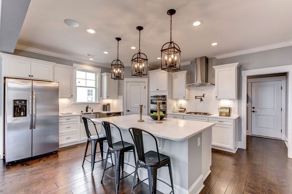 Open kitchen with white cabinets in new homes in johns island sc